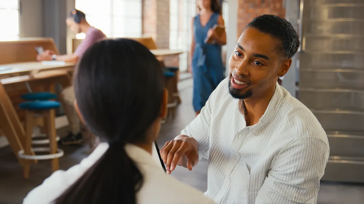 Business owner meeting a customer